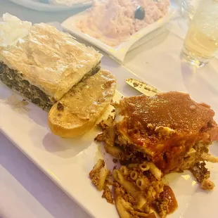 Combination plate with Spanakopita, greek potato and Pastichio.