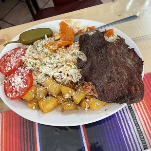 Enchiladas authentic mexican style with cotija cheese and onions inside, and dried meat. (Carne asada/ type of mexican beef jerky)