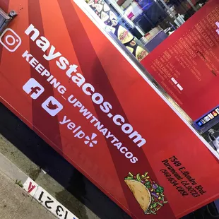 a taco truck parked on the side of the road