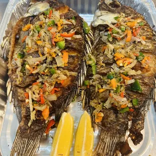 two whole fish on a tray