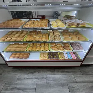 Variety of baked goods and donuts. There&apos;s another case that has all donuts.