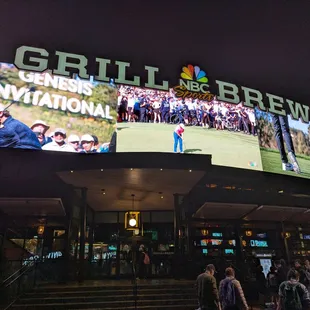 Outside. Storefront and patio on Monday night, January 6, 2025. PGA Tour golf on the big screens.