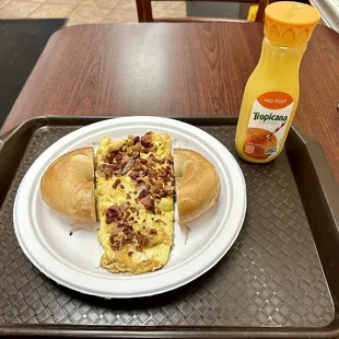 Meat Lovers omelet with toasted plain bagel buttered, orange juice.