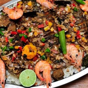 a platter of rice and shrimp