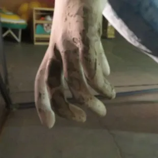 The angel's hand shows wear from the desert sun and sand.