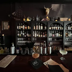 a bar with bottles of alcohol