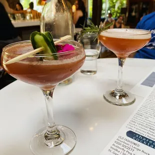 two cocktails on a table