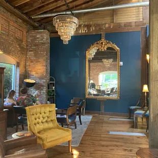 a living room with exposed brick walls