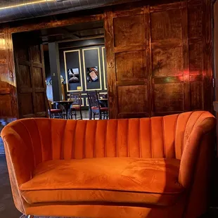 Bar area looking into other room with tables