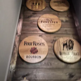 Awesome bourbon barrel head collection on the way down the stairs.