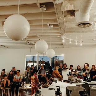 a large group of people in a coffee shop