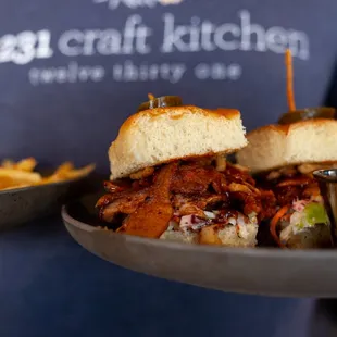 a plate of pulled pork sandwiches