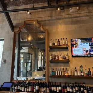 a bar with bottles of wine