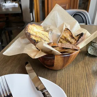 a basket of bread and a fork