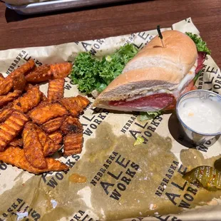 Sweet potato fries  (extra lil charge) Toasted Italian melt with a side of garlic aioli sauce. Sweet heat pickles.