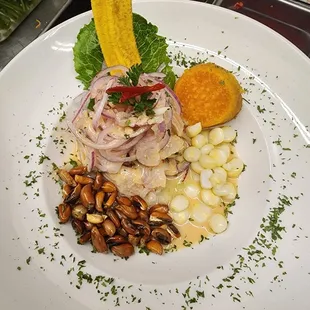 Ceviche :fresh fish with Peruvian seasoning cilantro,fresh squeezed lime juice,onions,2 different Peruvian corn