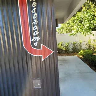 Bathrooms to right of building