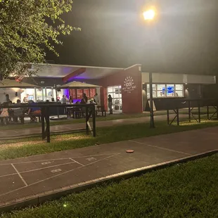 people sitting outside at night