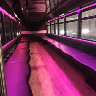 Bus #9 - seats up to 40 passengers, wood flooring, continuous wrap-around seating, LED lights, stereo, climate control, &amp; cup holders!