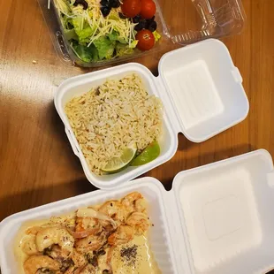 a variety of food in containers on a table