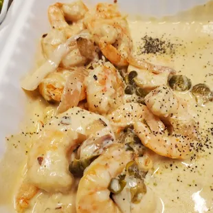 shrimp and cheese in a creamy sauce