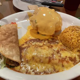 Delicious cheese enchilada, crispy taco, rice and queso puff!