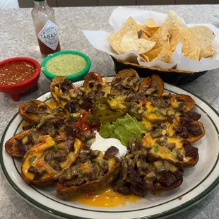 Pappa Nachos NOT on the menu but you can ask for them. Splash some Tabasco on top and hold on tight!  Good stuff!!!