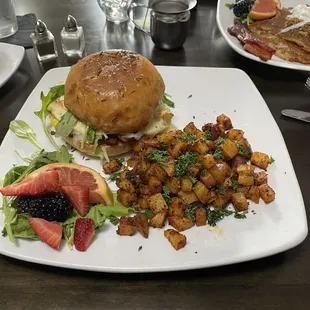 Breakfast sandwich with potatoes.