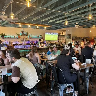 a large group of people sitting at tables