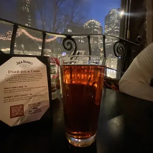 a glass of tea on a table