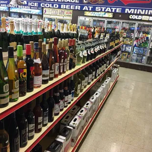 bottles of wine on shelves in a store