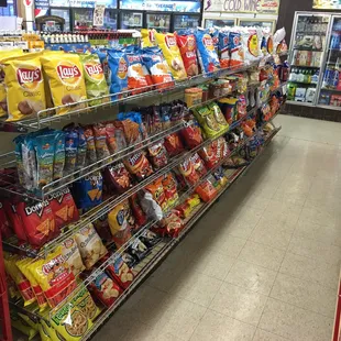 a shelf of chips and snacks