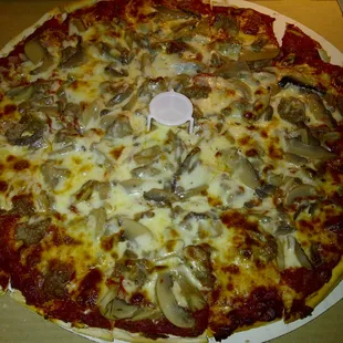 Cheese, sausage, mushroom and onion pie.