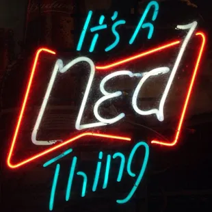 a neon sign that says it's a ned thing