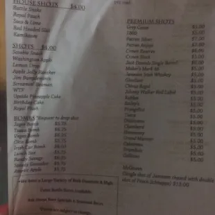 a hand holding a menu