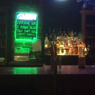 a neon sign in a bar