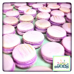 a pile of purple macarons