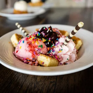 a bowl of ice cream and waffles