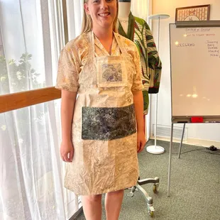 Showing off her custom made apron she learned in our Stitch x Stitch class!