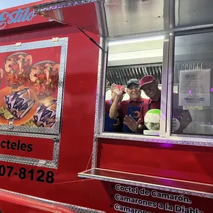 a man standing in front of a food truck