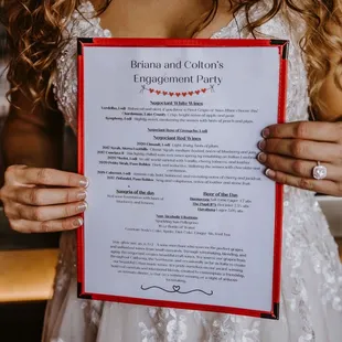 a woman holding a menu