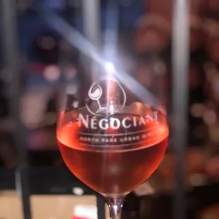 a glass of wine on a table