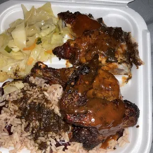 Jerk chicken platter with cabbage and rice with peas