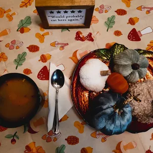 a bowl of soup and a plate of food