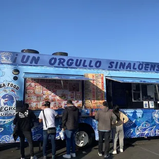 people ordering food from a food truck