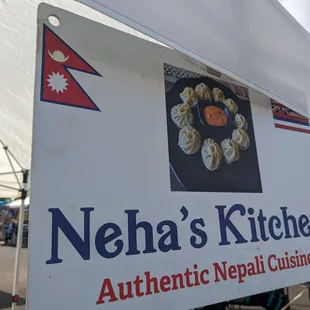 a sign for neha's kitchen