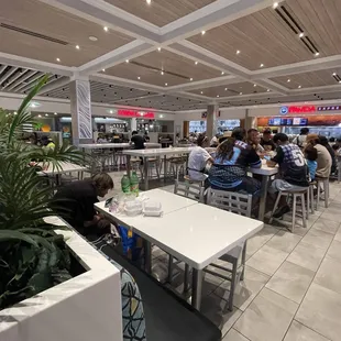 people sitting at tables and eating