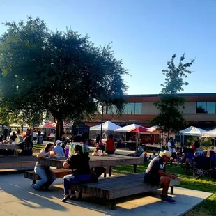 a crowd of people sitting on benches
