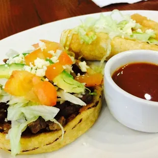 Sope with taquitos combo...side of homemade sauce.