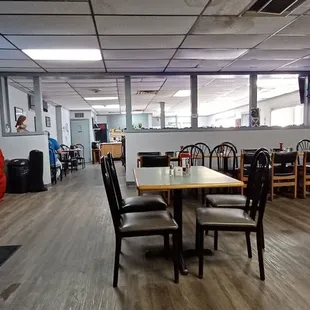 a dining room with tables and chairs